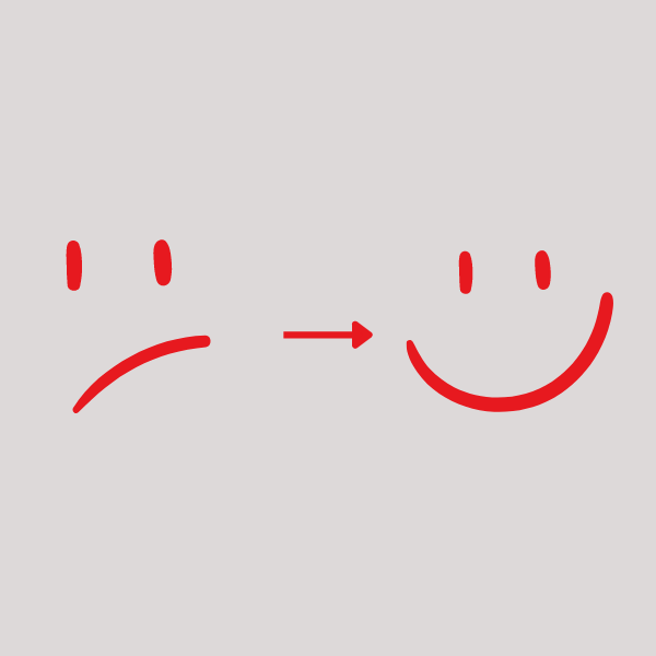 A smiley face is drawn in red ink, then an arrow pointing toward a smiley face
